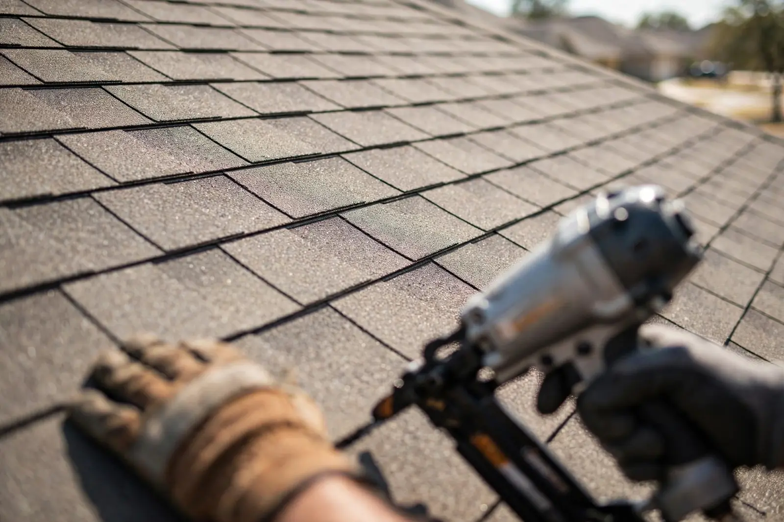 Architectural asphalt shingles being installed on a roof in Dallas, TX